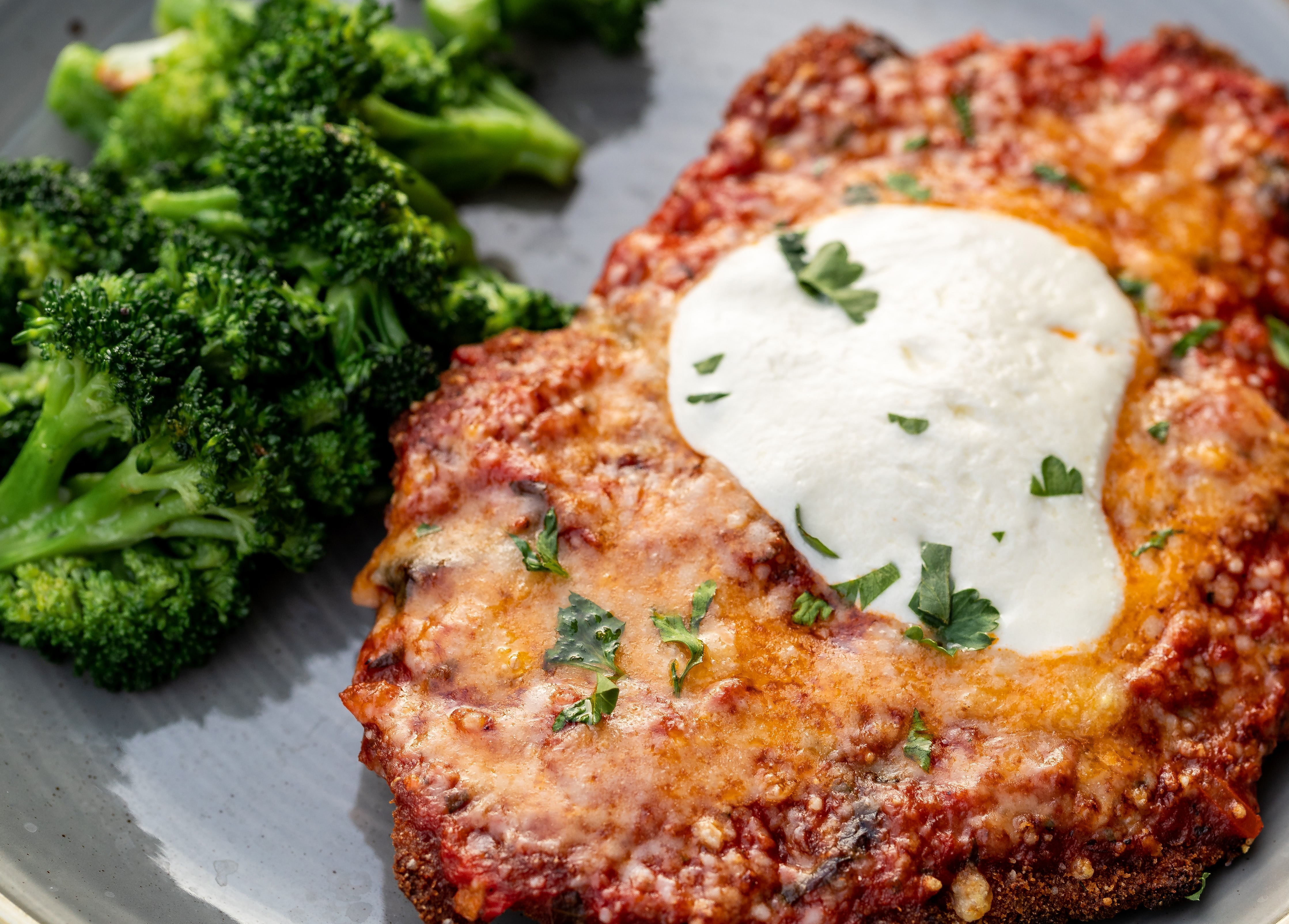 Chicken with red sauce and parmesan