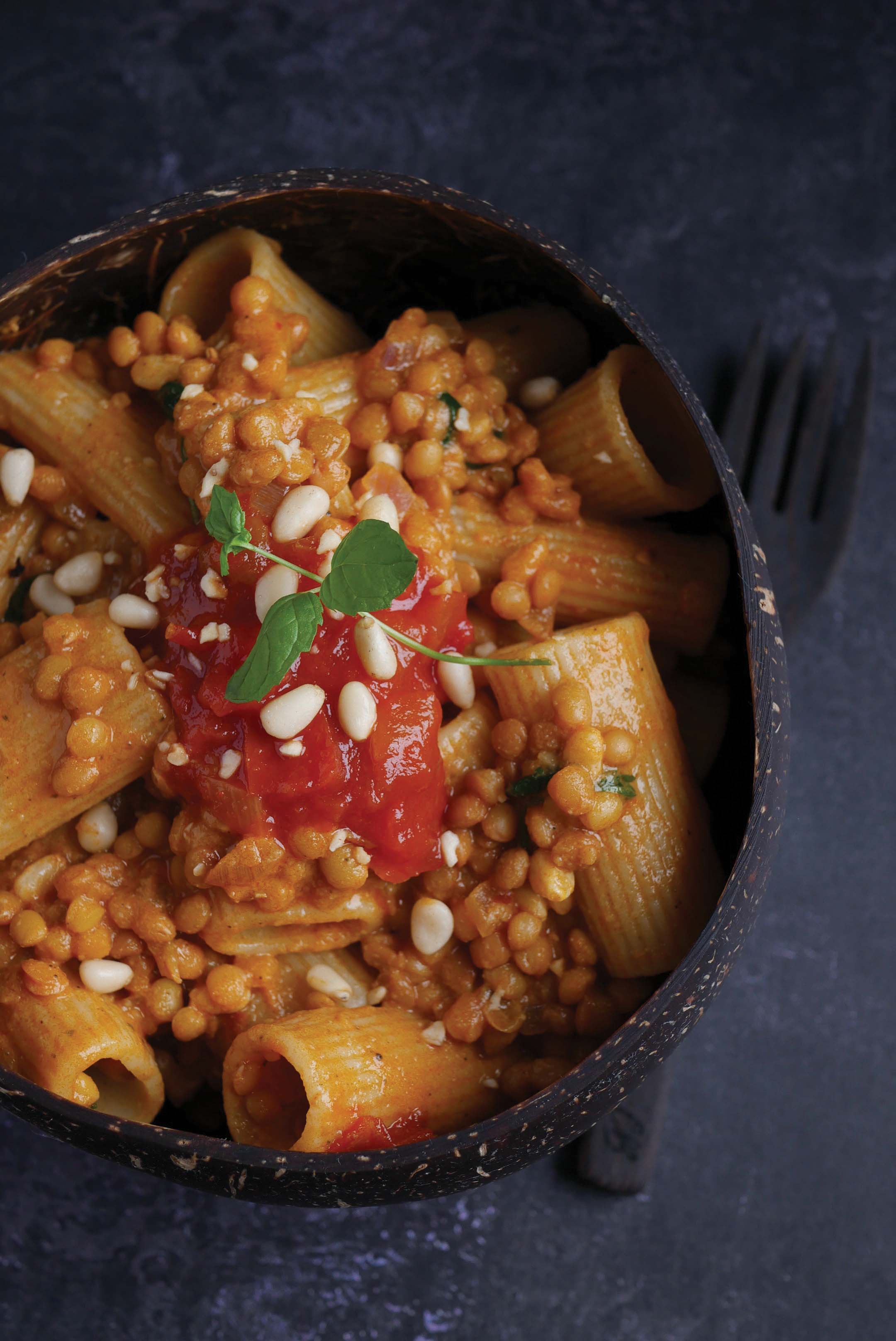 Radiatore pasta served in a tall bowl