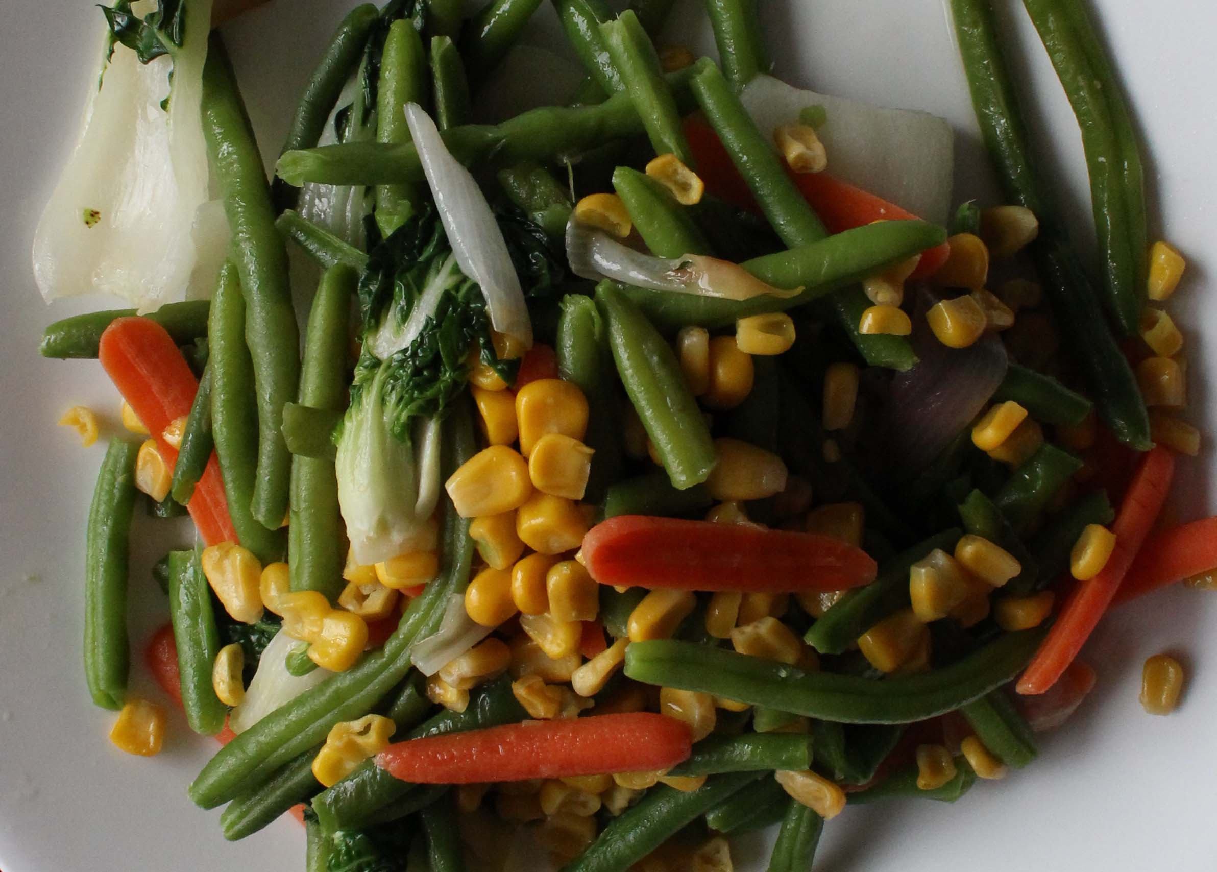 Green beans with bacon and lightly tossed with oil and seasoning